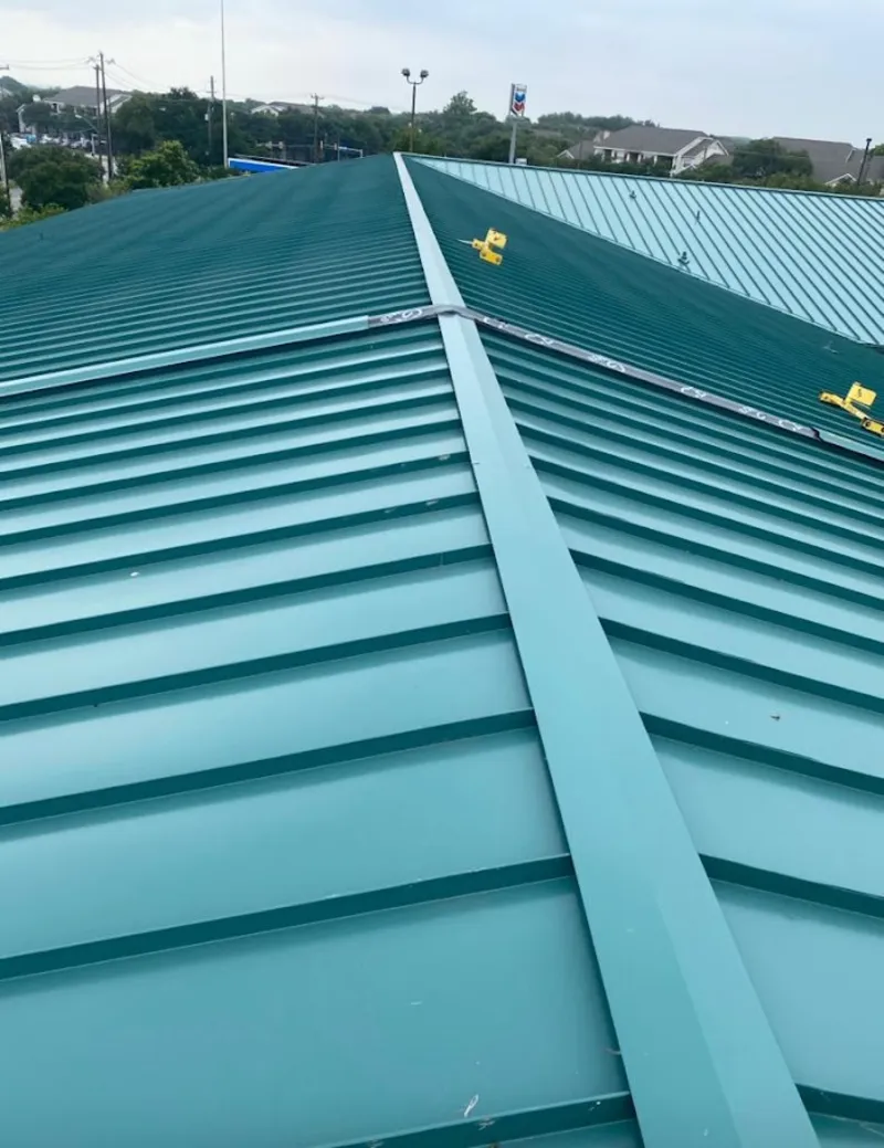 Green commercial metal roof ridge and valley for Metal Roof Repair in Wilbraham